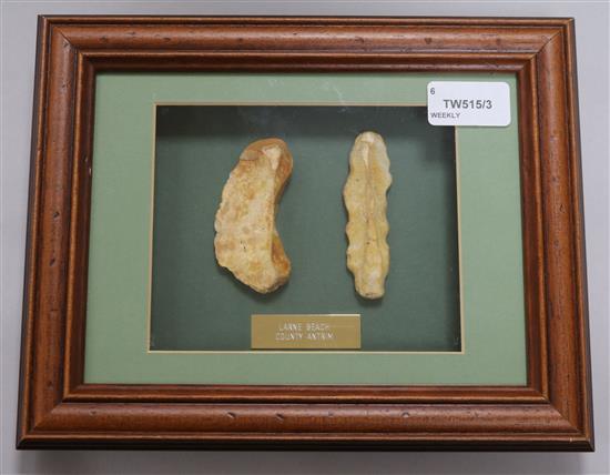 A collection of framed Neolithic and other tools and flint arrow heads,